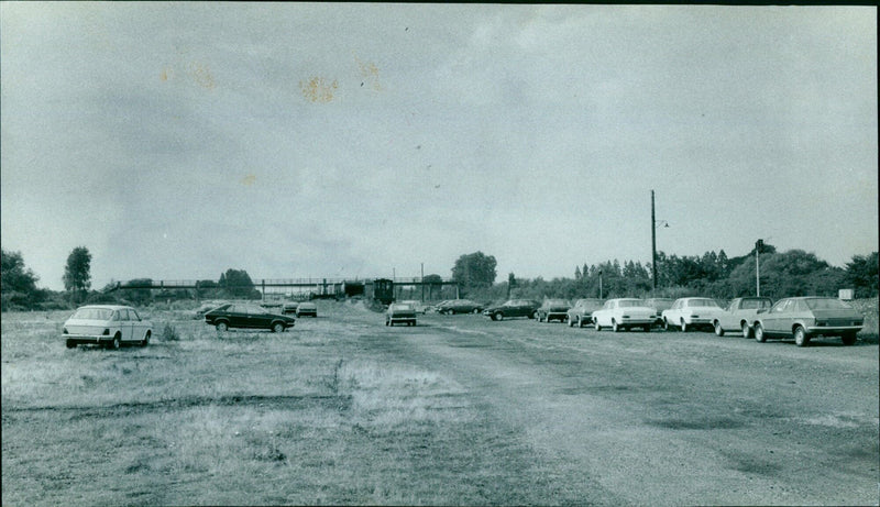 A train loaded with 850 cars moves along a sidings at Leyland, UK. - Vintage Photograph