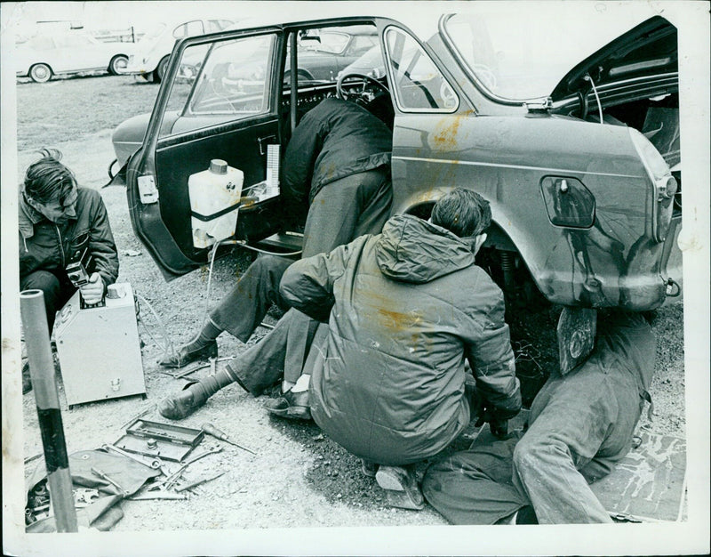 A British Leyland 1808 being serviced during a tryout at Thruxton Circuit in preparation for the London to Sydney Marathon. - Vintage Photograph