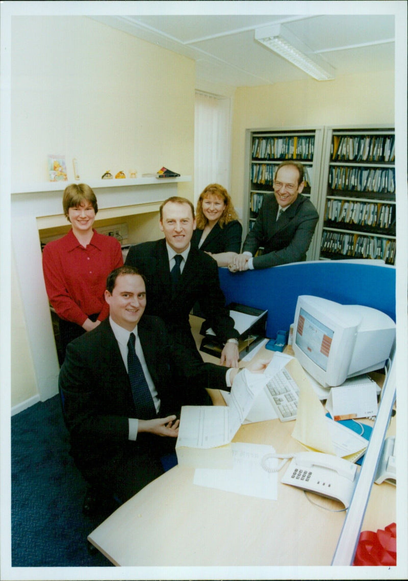 Five payroll department members of James & Cowper pose for a photograph. - Vintage Photograph