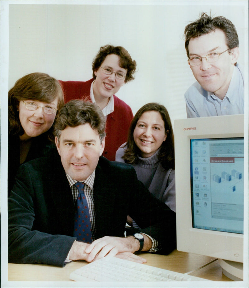 Margaret Hanle, Kristen Robinscn, Mark Rows, Vicky Buser, and Mike Sullivan work together on a project. - Vintage Photograph