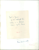 TE Ihre L Jones sits in a flooded room of her home in Wellington Street. - Vintage Photograph