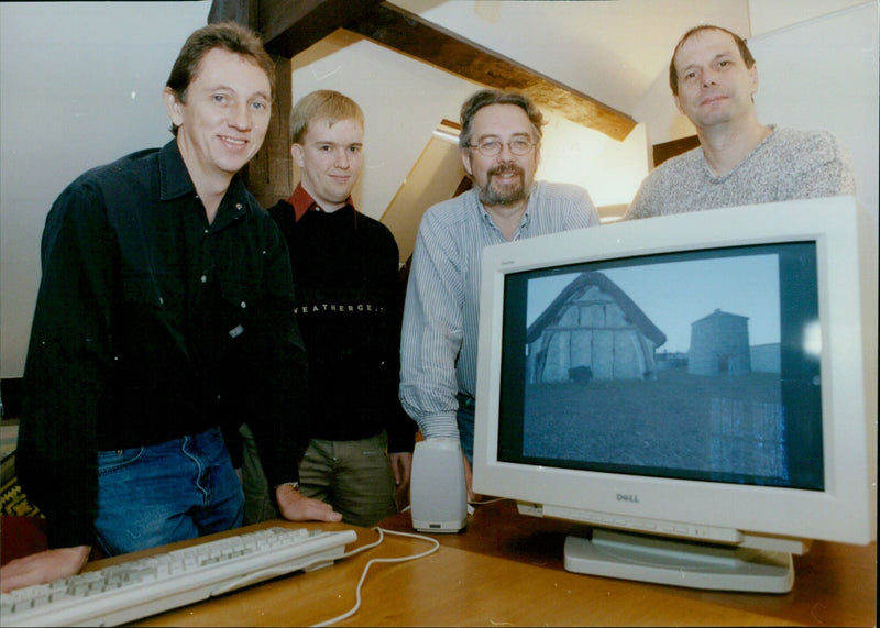 A group of business professionals pose with a robotic doll at Oxford Immersive Education. - Vintage Photograph