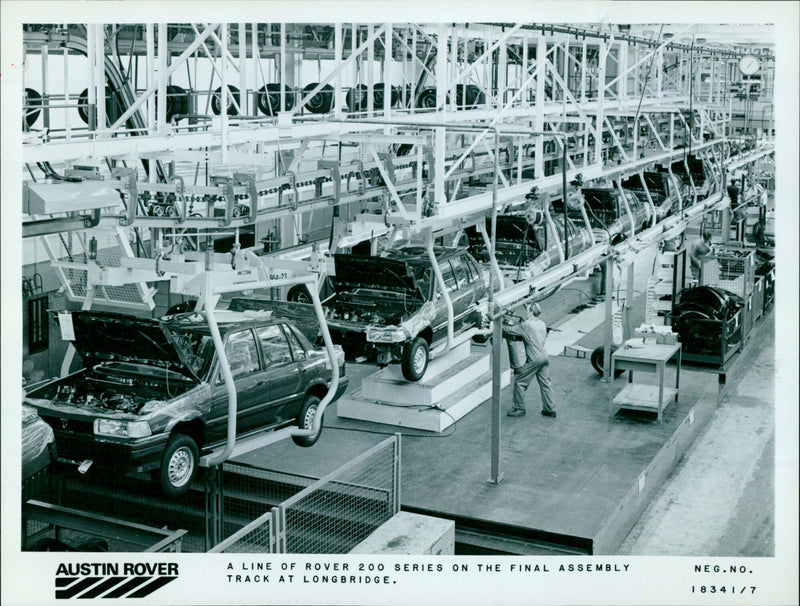 A line of Austin Rover 964-23 cars passes through the final assembly track at Longbridge. - Vintage Photograph