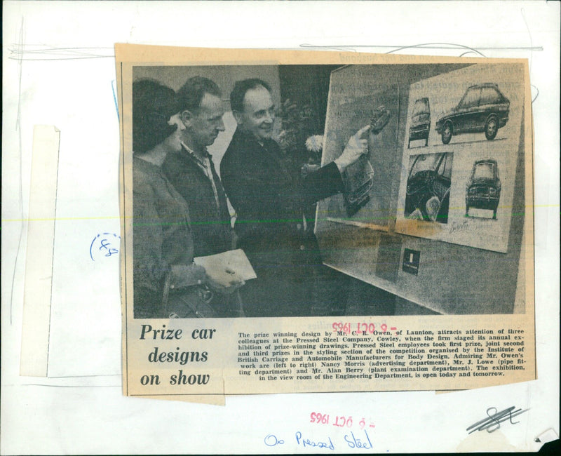 On display at the Pressed Steel Company in Cowley, three colleagues admire a prize-winning car design by Mr. C. R. Owen. - Vintage Photograph