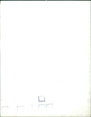 A family walks along the beach on a sunny day. - Vintage Photograph