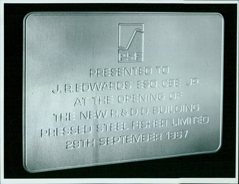 J.R. Edwards CEE. JP. is presented with a plaque at the opening of the new Research & Development Building of Pressed Steel Fisher Limited. - Vintage Photograph