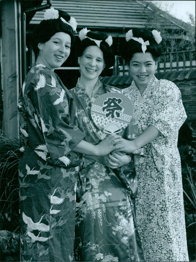 Three members of the musical youth company prepare for their upcoming performance of "The Mikado". - Vintage Photograph