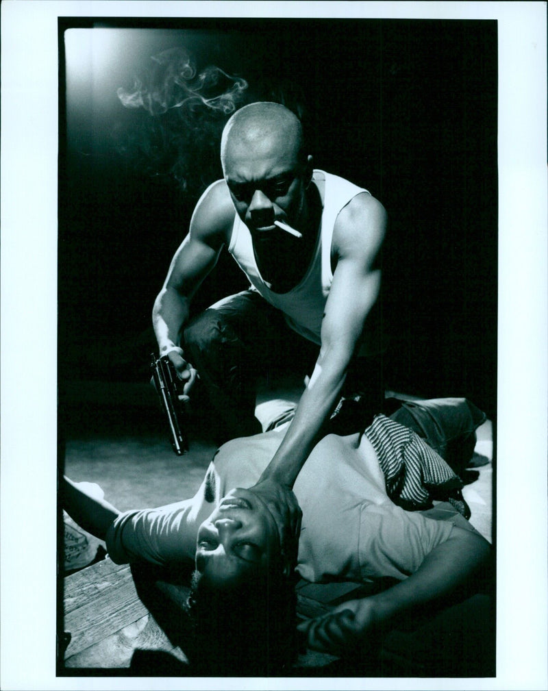 Actors Oso and Jocelyn Jee perform in the drama playhouse Bonded. - Vintage Photograph