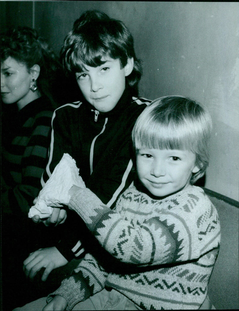 Christian Hamlir, 8, of Kidlington, shares his sweets with Daniel Smith, 5. - Vintage Photograph