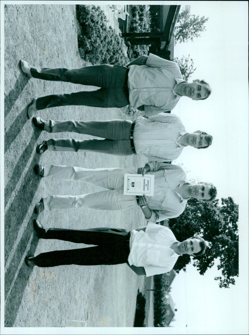 Chris Yates (left) and John Denton (right) proudly display their certificates of achievement. - Vintage Photograph