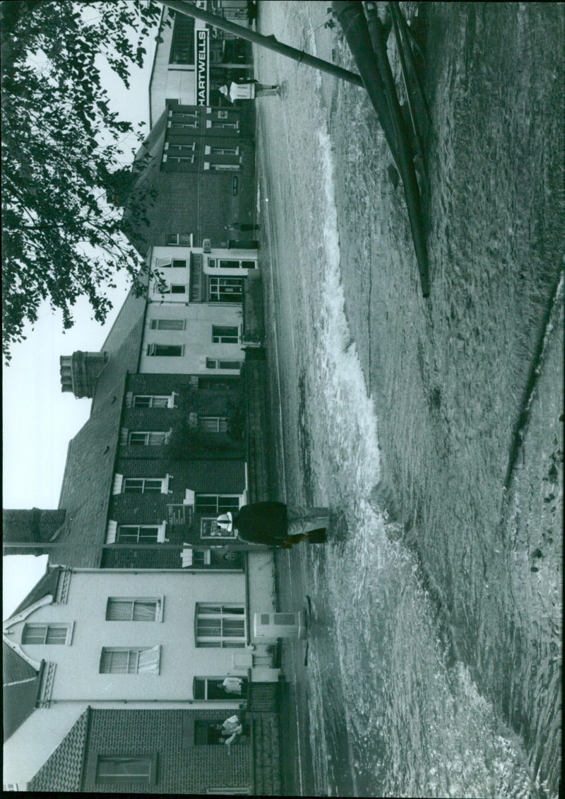 Emergency personnel respond to an unexpected burst water main in Hartwells, North Carolina. - Vintage Photograph