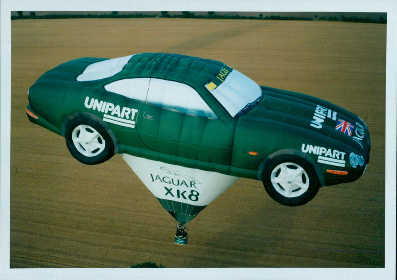 Unipart is celebrating the launch of the Jaguar XK8 with a hot air balloon. - Vintage Photograph