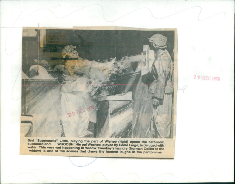 Actors Eddie Large and Syd "Supersonic" Little in Widow Twankey's Laundry during a pantomime performance. - Vintage Photograph