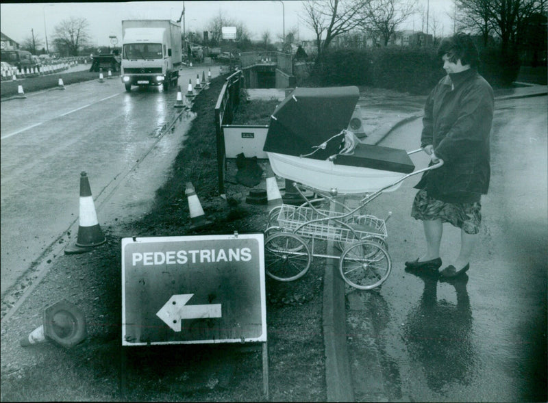 Mrs Lynda Slay pushing her daughter Nicola to cross a by-pass at Headington. - Vintage Photograph