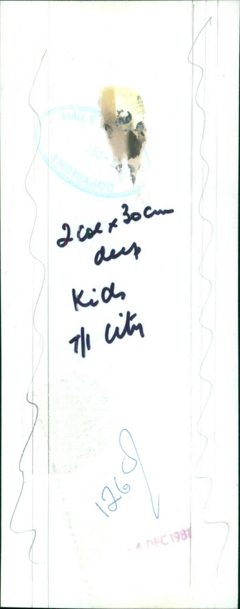 A young girl sits in a park in the city on July 1, 2021. - Vintage Photograph