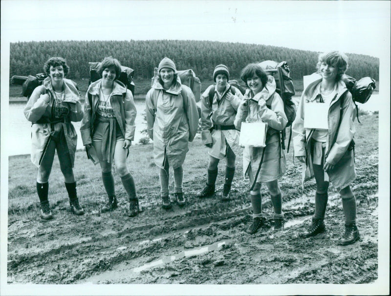 Four female apprentices learning to weld at a training facility. - Vintage Photograph