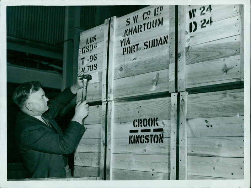 A man carries goods from a market in Khartoum, Sudan. - Vintage Photograph