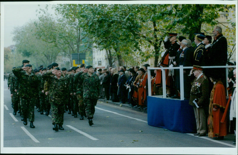 Members of the community gather to remember the life of a fallen soldier on the anniversary of their death. - Vintage Photograph