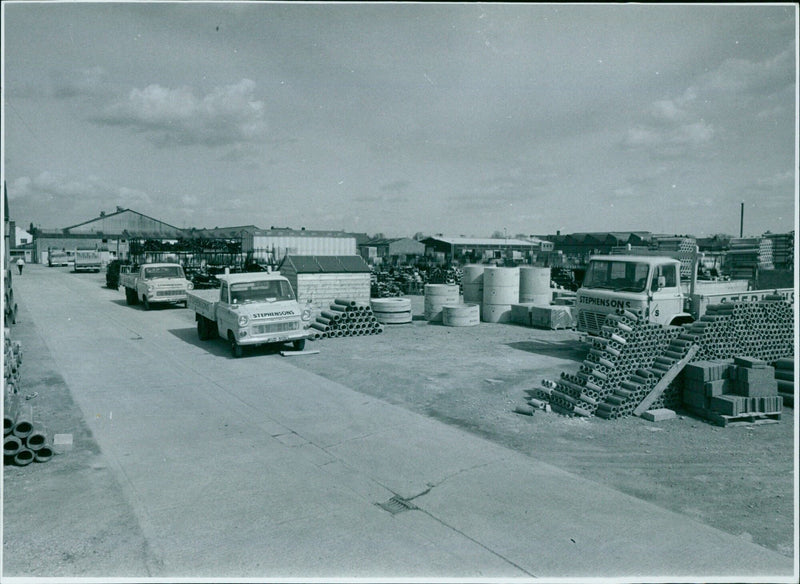 Stephenson's Ellis Building Materials yard being exposed to paper. - Vintage Photograph