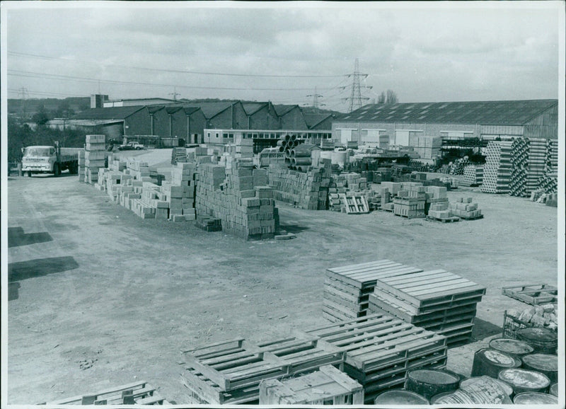 Workers in a building materials yard at Stephensons Supplies, Inc. - Vintage Photograph