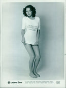 Birmingham model Penny tries on the latest t-shirt from Leyland Cars. - Vintage Photograph