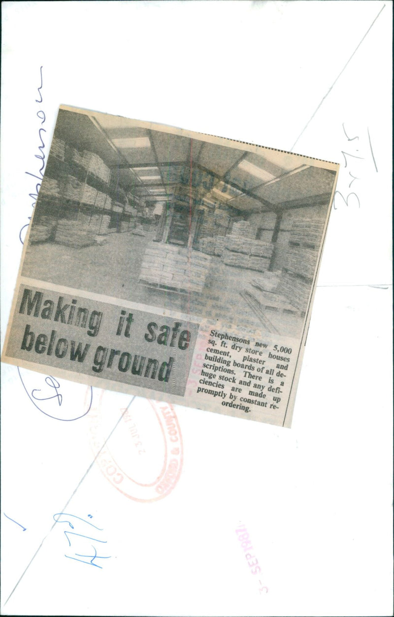 A worker inspects a section of Stephenson's new 5,000 sq. ft. dry store houses. - Vintage Photograph