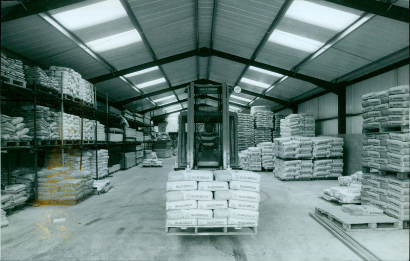 A worker inspects a section of Stephenson's new 5,000 sq. ft. dry store houses. - Vintage Photograph