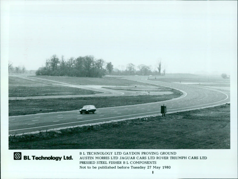 Employees from BL Technology Ltd. inspect car parts at the Gaydon Proving Ground. - Vintage Photograph