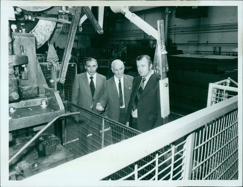 Three representatives from the Cowley Body Plant inspecting a guard designed by Harry Goodings. - Vintage Photograph