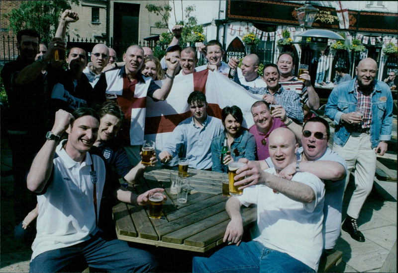 Keith Miles leads a group of people celebrating St George's Day in Oxford, England. - Vintage Photograph