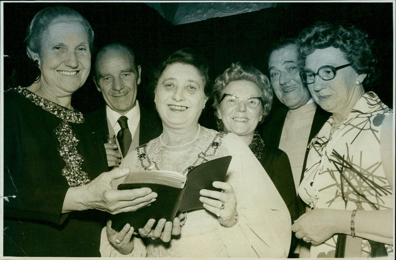 Alumni from Exford University pose for a photo at a reunion. - Vintage Photograph