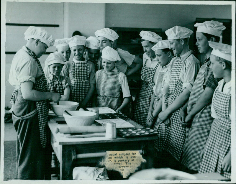 Students of Bottey County School exchange recipes in a history class. - Vintage Photograph