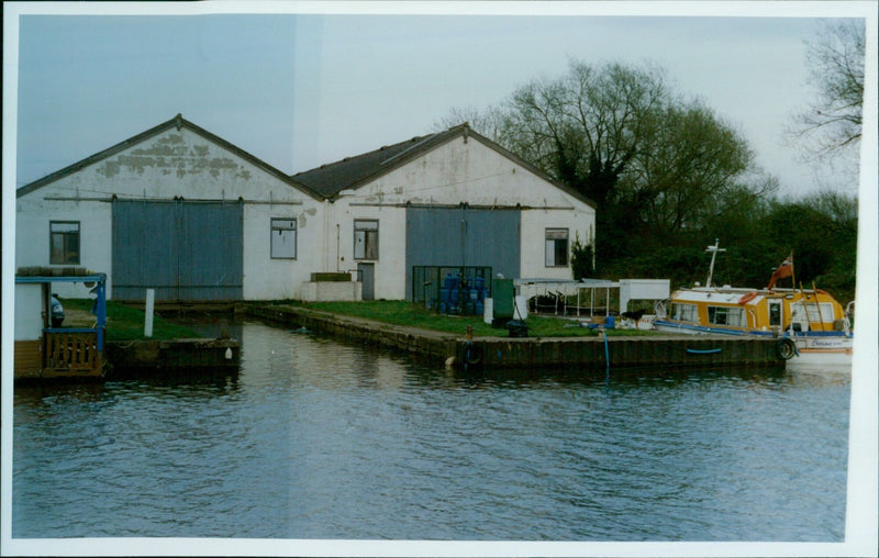 An emotional scene is seen at Salters Boatyard in Donnington Bridge after a tragedy. - Vintage Photograph