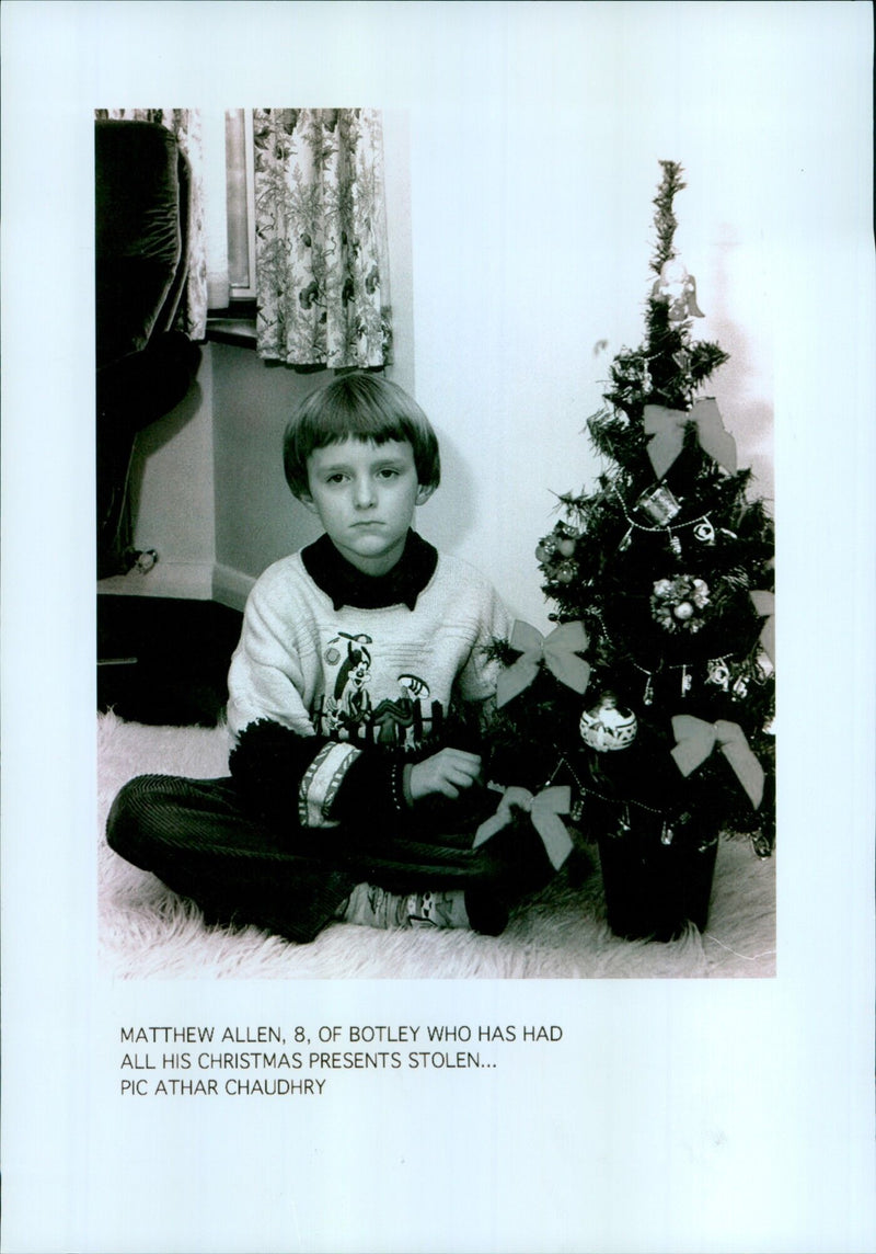 Matthew Allen, 8, of Botley, England, looks on sadly after all his Christmas presents were stolen. - Vintage Photograph