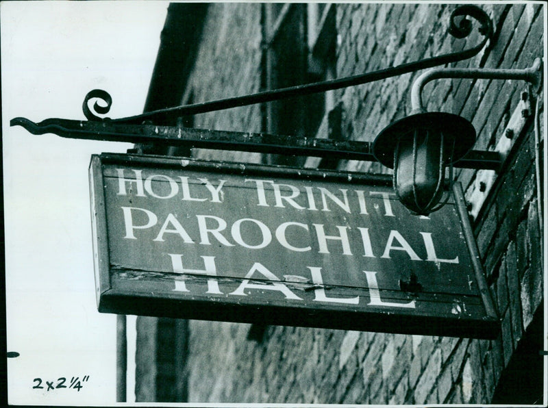 Parishioners of Holy Trinity Parochial Hall gather for a service in St. Ebbes, England. - Vintage Photograph