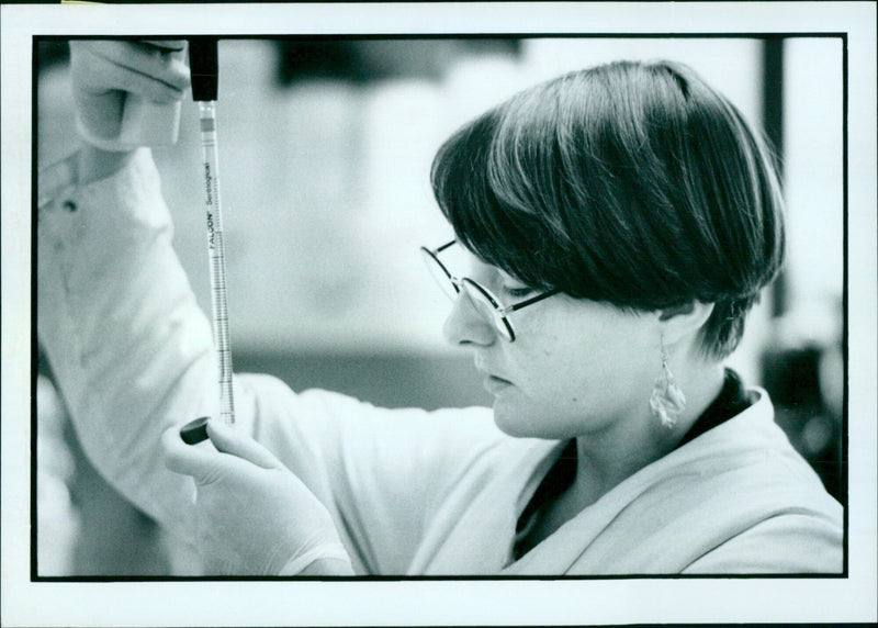 Healthcare workers receive the first doses of the FALCON Serological T test at a hospital in Lsingis. - Vintage Photograph