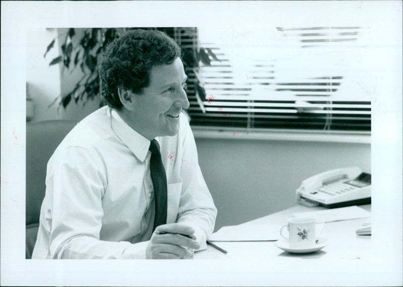 Dr Keith McCullagh poses with a surprise birthday cake on 20 June 1991. - Vintage Photograph