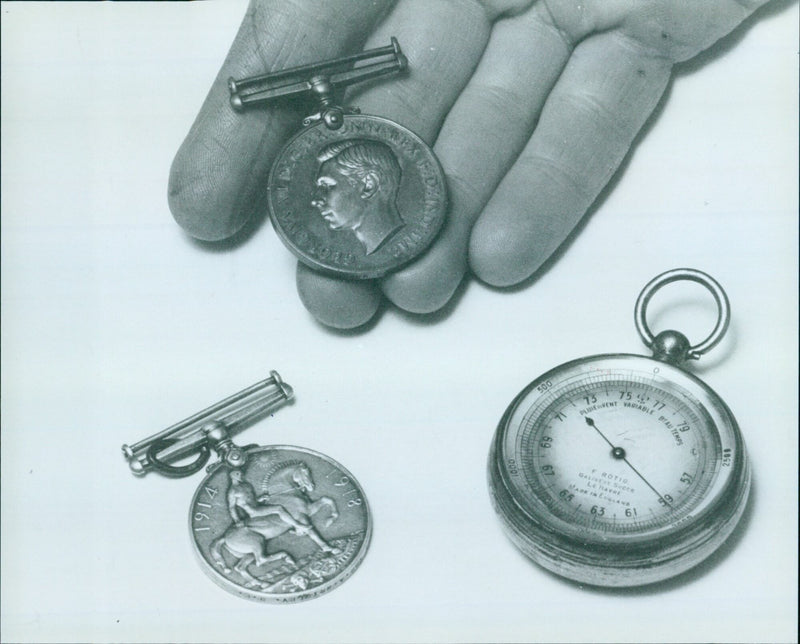 A display of stolen objects at Cowley Police Station, including a Special Constabulary Medal, a George V Medal and a pocket barometer. - Vintage Photograph