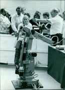 "Father and daughter embrace on a beach in August 1986." - Vintage Photograph