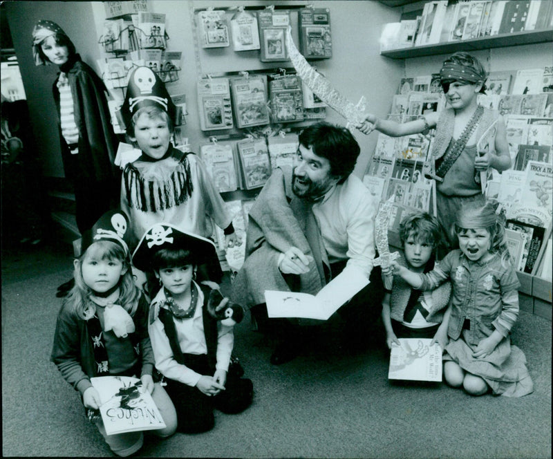 Children dressed as witches enjoy trick-or-treating on Halloween. - Vintage Photograph