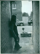 Firefighters battle a large fire in a residential area. - Vintage Photograph