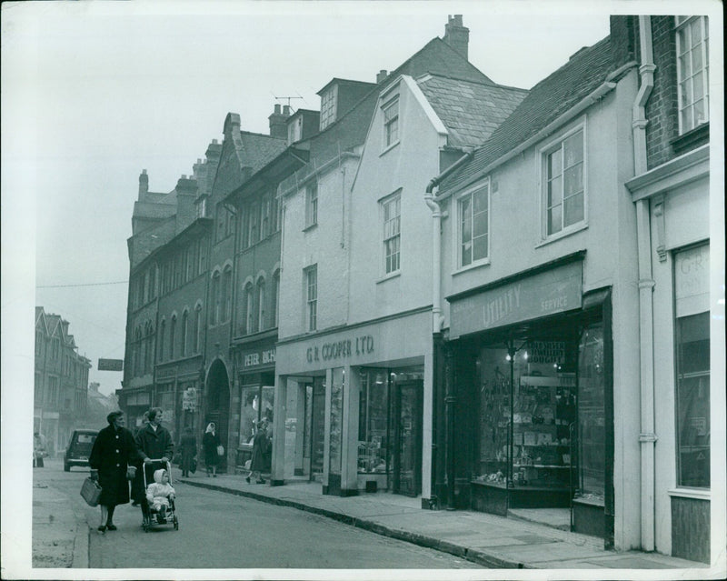 A car is seen making a turn in Oxford, England. - Vintage Photograph