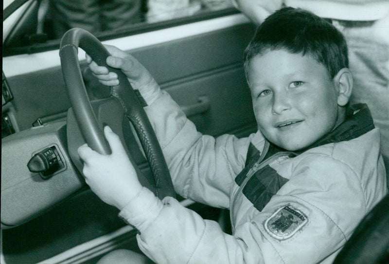 A man drives a Metro rally car at the Austin Rover Open Day rally in Stonesfield, England. - Vintage Photograph