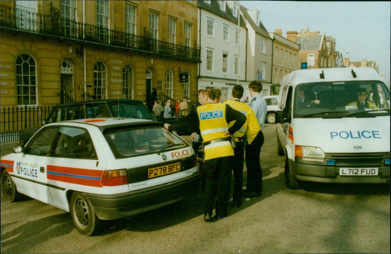 Police and military personnel respond to a security alert outside an Army and RAF Careers Office in Oxford, UK. - Vintage Photograph