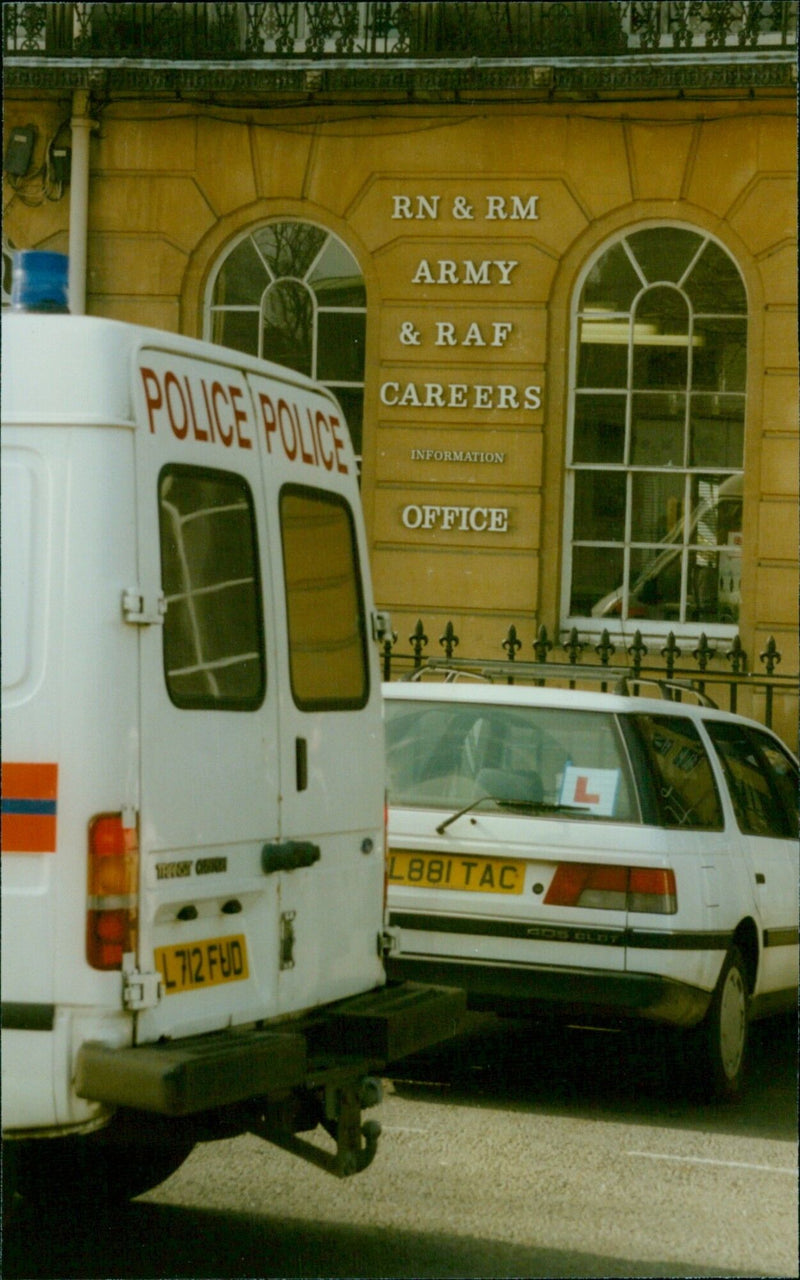 Police presence outside an Army and RAF Careers Information Office in Oxford, England. - Vintage Photograph