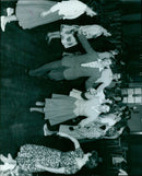 Astronauts Virgil I. Grissom, John W. Young, and Alan B. Shepard Jr. pose with a full-scale model of the Mercury-Redstone spacecraft. - Vintage Photograph