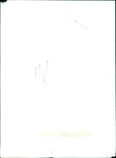 A group of people walking on a street carrying a large banner - Vintage Photograph