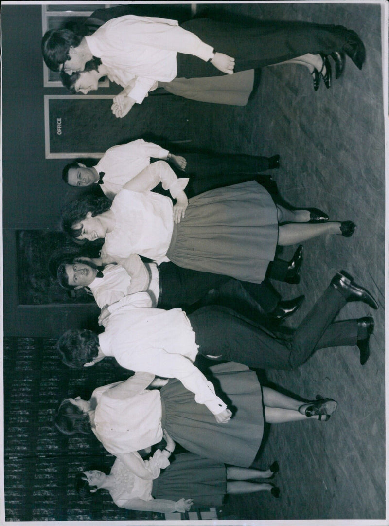 Three people enjoying music and dancing at a folk event. - Vintage Photograph