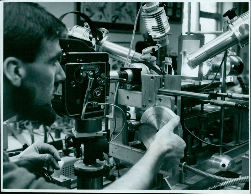 Scientists examine specimens in a laboratory. - Vintage Photograph