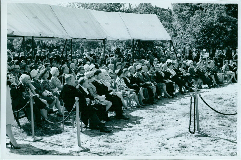 A large crowd of people gathered at Oxford to welcome the new President of the National Organization of Civil Servants (NOCSI), Mee Millen, on June 14, 1962. - Vintage Photograph